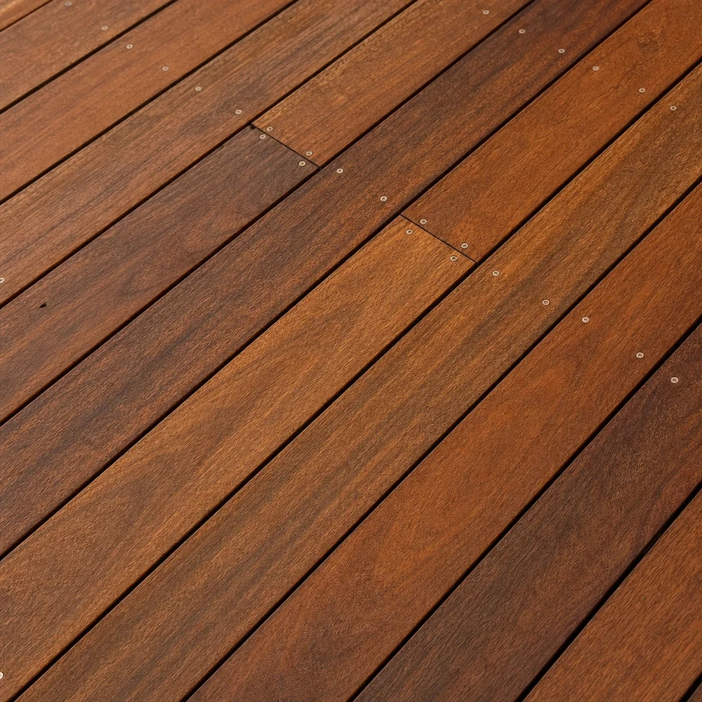 Close-up of restored warm timber decking with diagonal boards and visible grain
